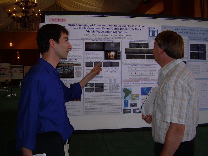 Posters Farzad Kamalabadi of U IL is asking Mike Taylor of USU about his student's poster.