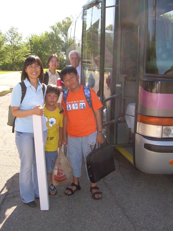 Boarding the bus at NCAR to drive to Santa Fe on Saturday June 23. Young-Sil Kwak and sons Jin and Seong; Janet (Zhen) Zeng and driver Andy H.
