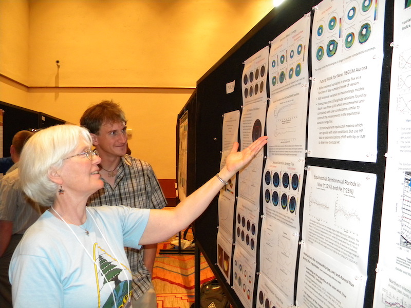 Barbara Emery of the National Center for Atmospheric Research explains her POLA-06 poster to Liam Kilcommons of the University of Colorado who was her REU student the previous summer. Barbara is the long-time organizer of the annual CEDAR Workshops.