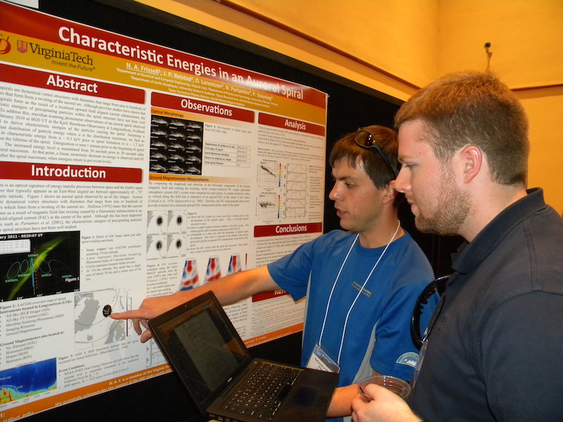Nathaniel Anthony Frissell of Virginia Tech explains his MIC-09 poster to Joseph Macon a GEM participant from VT. Nathaniel became the first year GEM student representative at the end of the workshop.
