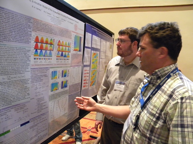 Roger Varney of Cornell University at his EQIT-12 poster listens to Phil Erickson of MIT/Haystack Observatory. Roger Varney won honorable mention in the IT student poster competition and is the first year student representative in the CSSC with primary responsibility for the joint Student Workshop with GEM.