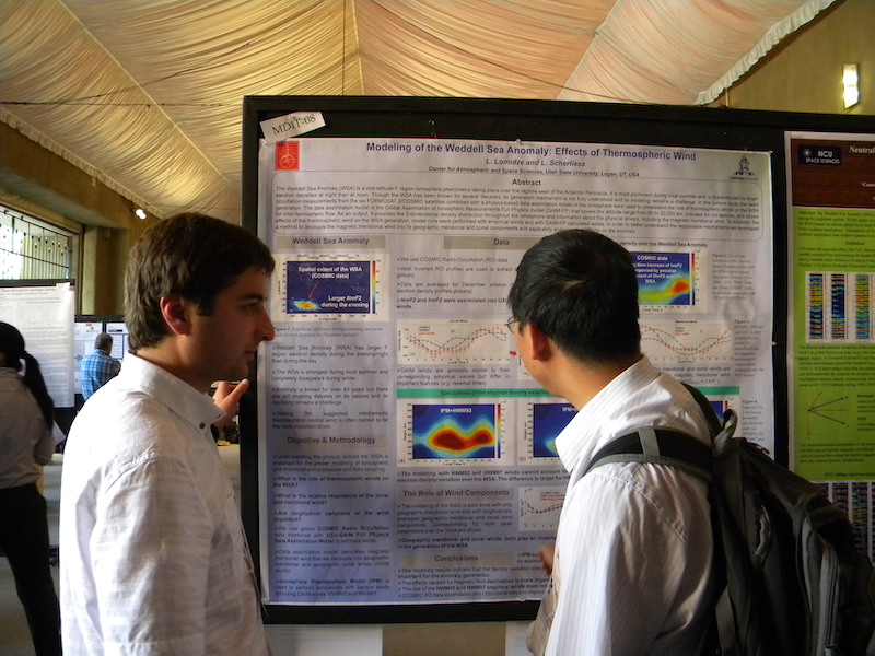 Levan Lomidze of USU explains his MDIT-08 poster to Chaosong Huang of Kirtland AFB