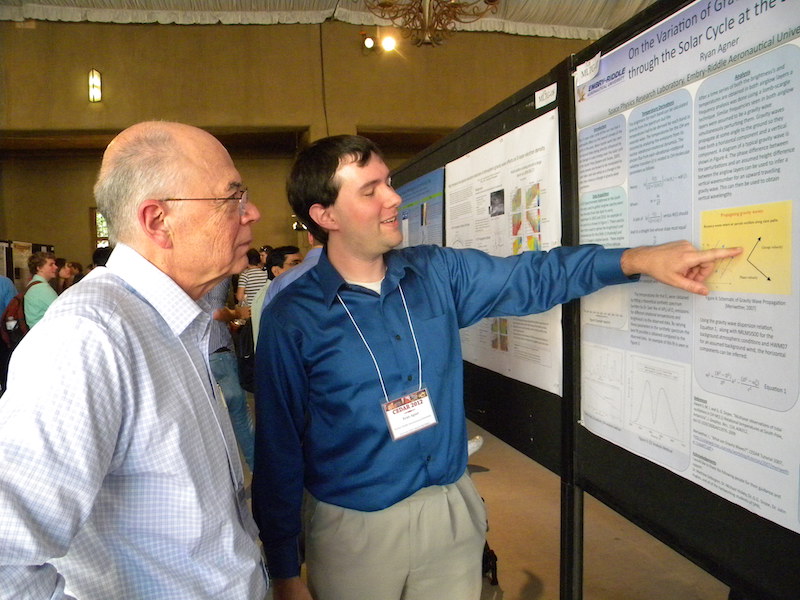 Ryan Agner of Embry-Riddle explains his MLTG-07 poster to Richard Walterscheid of Aerospace.