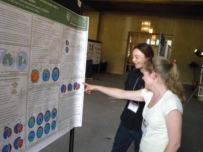 Ellen Cousins of Dartmouth (now a post-doc at HAO/NCAR) explains her POLA-07 poster to Mariangel Fedrizzi of NOAA.