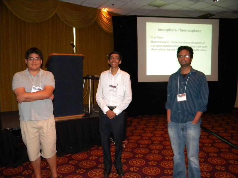 3 IT winners and honorable mention. Left to right: Enrique Rojas Villalba (JRO, Peru, IT second place), Nithin Sivadas (IIT, India, honorable mention), and Bharat Kunduri (VT, IT first place)], where Kshitija Deshpande (VT, honorable mention) is absent but shown in IT pictures above.