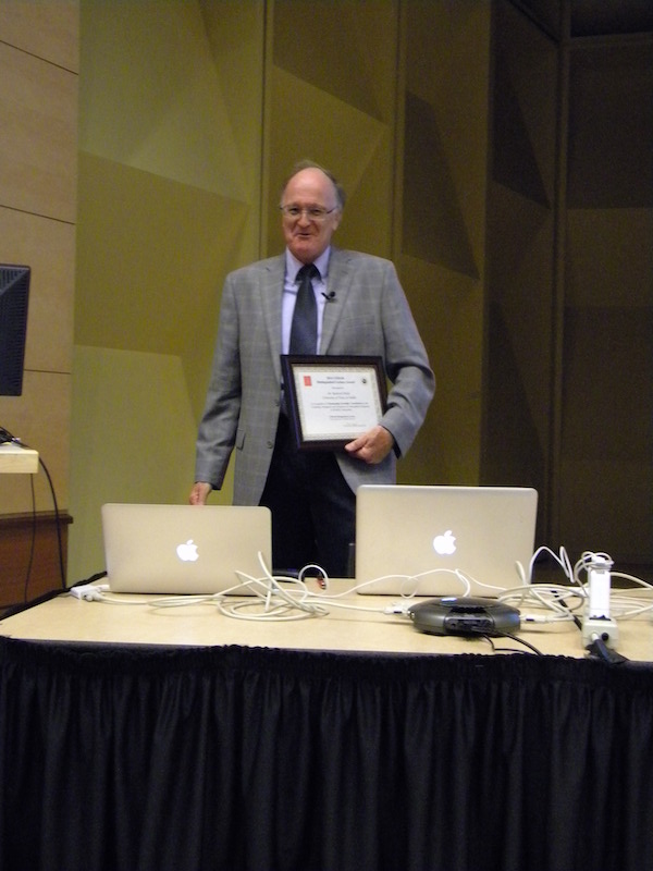 CEDAR Distinguished Lecturer Rod Heelis (UTD) holds his plaque of appreciation from the CSSC chair.