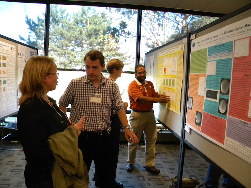Dustin Hickey (BU) explains his poster EQIT-04 to Anja Stromme (SRI Intl), while Ehab Hassan at poster EQIT-03 talks with Astrid Maute (NCAR) in the rear.