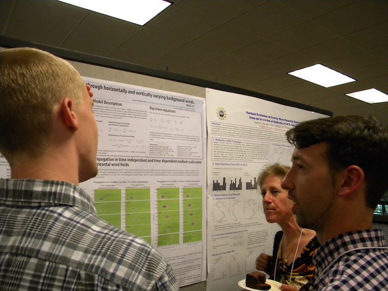 Chris Heale (Embry-Riddle) shows his poster MLTG-11 to Tim Duly (U IL, CSSC student rep) and Sharon Vadas (NWRA).