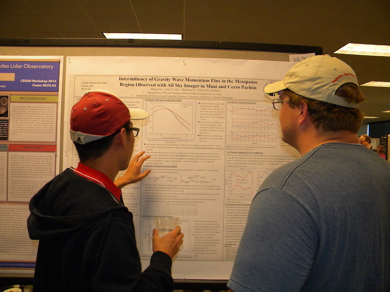 Bing Cao (Embry-Riddle) presents his poster MLTG-03 to Andy Gerrard (NJIT).