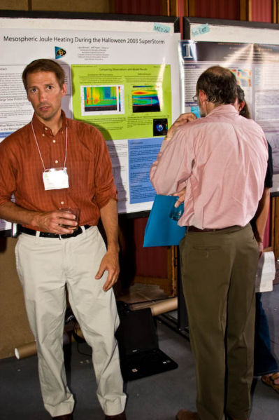 Jeff Thayer (CSSC incoming chair, U CO) in front of his student Laura Brower's poster (U CO)