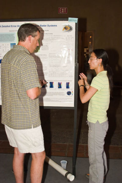 Chunmei Kang (honorable mention, U CO) and her advisor, Scott Palo (U CO) discuss her poster