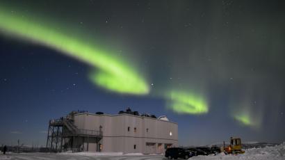 The Poker Flat Science Operation Center under small green auroral structures