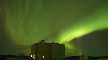 The Poker Flat Science Operation Center under green diffuse aurora