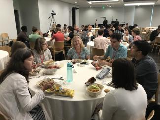 people having lunch at large round table